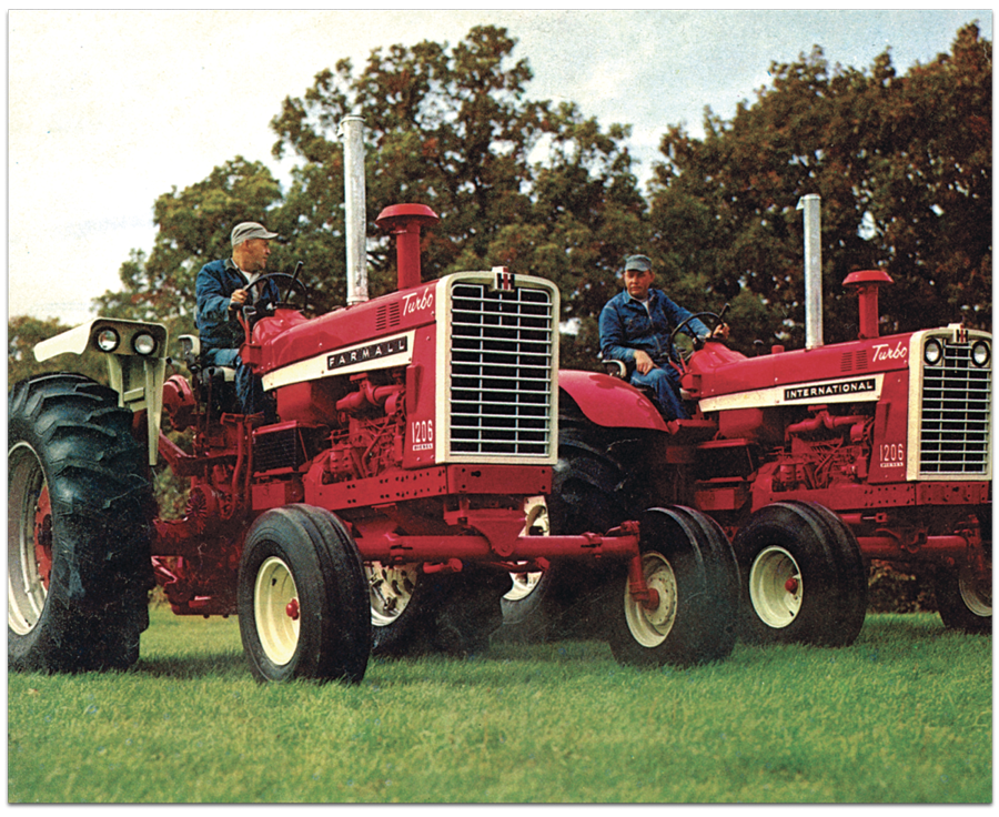 Two men sitting on Farmall tractors in field